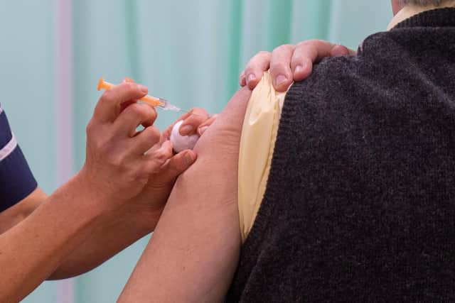 A patient receives an injection of a Covid-19 vaccine. Thousands of adults with learning disabilities on GP registers in Cambridgeshire and Peterborough will be prioritised for a coronavirus vaccine following new advice from Government advisers.. Photo: PA EMN-210224-144434001