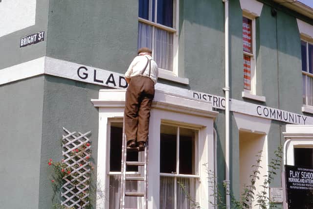 Mr Garn working on the GLADCA sign.