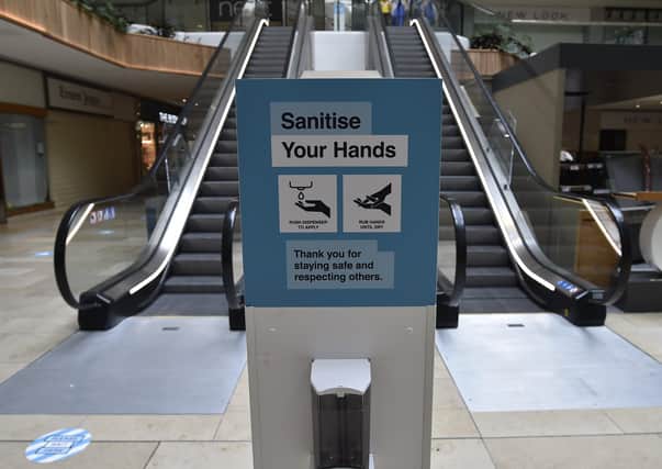 Hand sanitisers in Queensgate shopping centre. EMN-200615-114843009