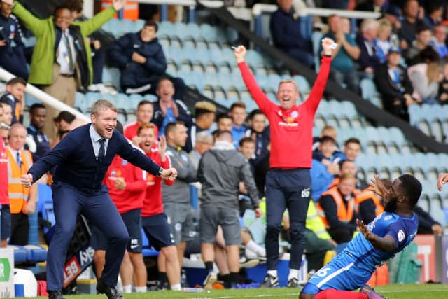 Junior Morias celebrates a goal for Posh against Wigan at London Road in September, 2018. Posh boss Grant McCann seems pretty pleased.