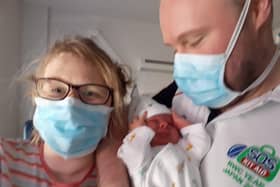Andy and Kathy with baby Dillon in hospital.