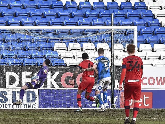 A Wigan corner sails over Posh galkeeper Christy Pym's head to give the visitors the lead. Photo: David Lowndes.