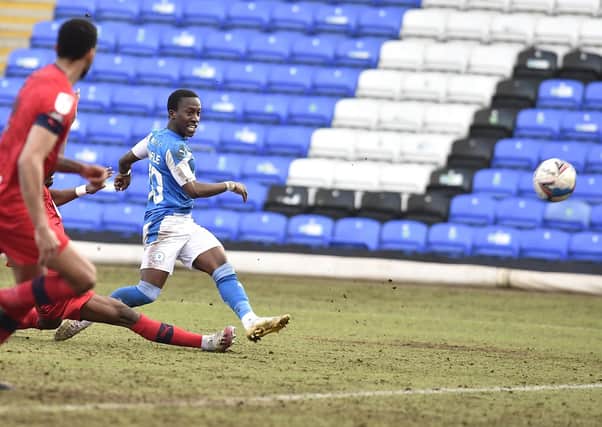 Posh star Siriki Dembele saw this shot well saved by Wigan goalkeeper Jamie Jones. Photo: David Lowndes.