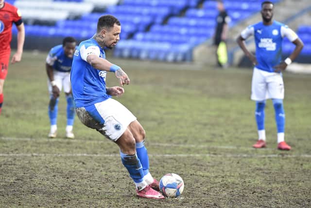 Posh striker Jonson Clarke-Harris converts the match-winning penalty against Wigan. Photo: David Lowndes.