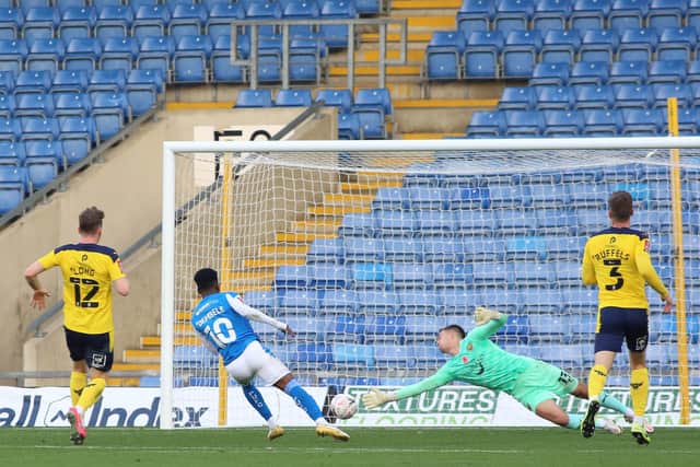Siriki Dembele scores for Posh at Oxford in an FA Cup tie earlier this season. Photo: Joe Dent/theposh.com.