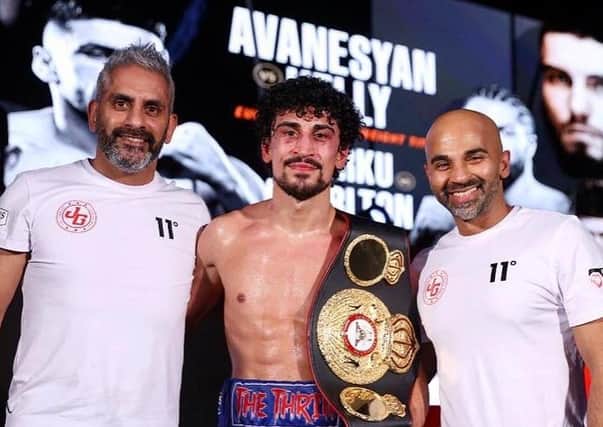 Jordan Gill flanked by pather Paul Gill (left) and trainer Dave Coldwell. Photo: Mark Robinson/Matchroom Boxing.