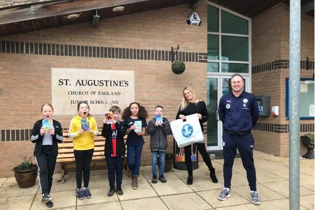 Gavin Slater, Community Manager at Peterborough United Foundation presenting free World Book Day books.
