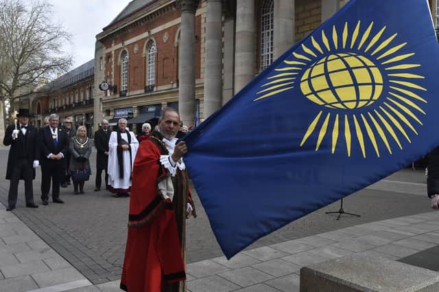 Raising of the Commonwealth flag last year outside Peterborough Town Hall by Mayor of Peterborough cllr. Gul Nawaz EMN-200903-140451009