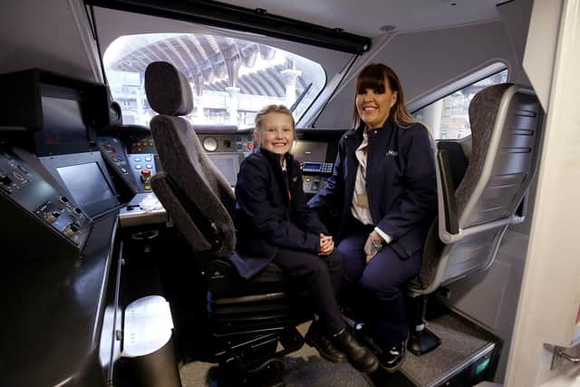 Train Driver Becky Brown and her eight year old daughter Maisie helping to launch the initiative for International Women's Day. Maisie wants to follow in her Mum’s footsteps to become a train driver when she is older. Photo: Nigel Roddis/PA Wire EMN-210503-124034001