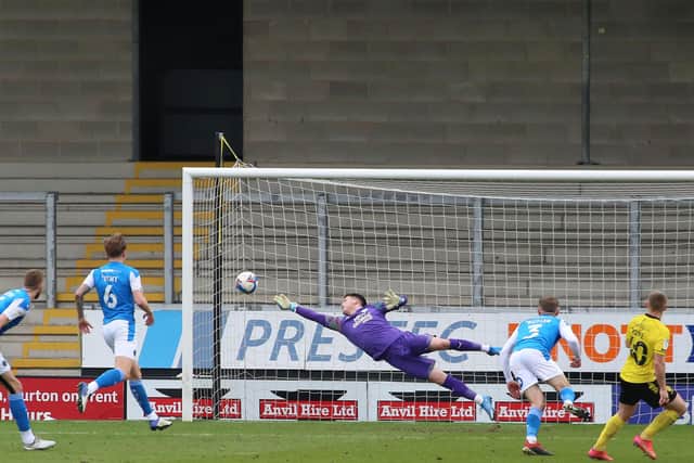 Christy Pym of Peterborough United makes a diving save against Burton Albion - Mandatory by-line: Joe Dent/JMP - 06/03/2021 - FOOTBALL - Pirelli Stadium - Burton-upon-Trent, England - Burton Albion v Peterborough United - Sky Bet League One