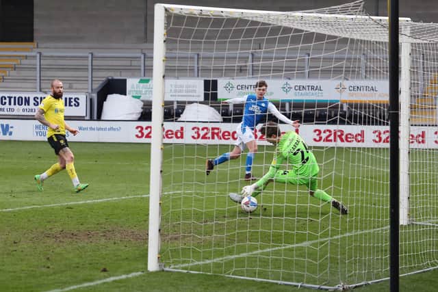 Harrison Burrows scores his first senior goal for Posh at Burton. Photo: Joe Dent/theposh.com.