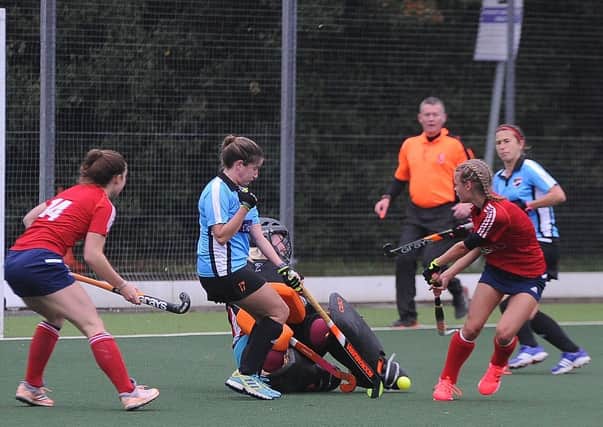 City of Peterborough Ladies (red) in action.