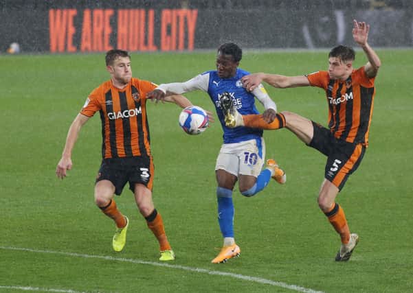 Siriki Dembele in action for Posh at Hull City earlier this season.