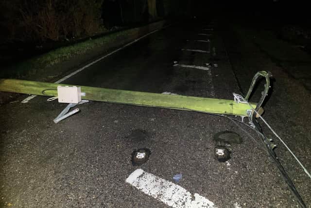 Teams worked overnight to reopen Dowgate Road near Leverington after a tree brought down power cables. Pic: Cambs Police