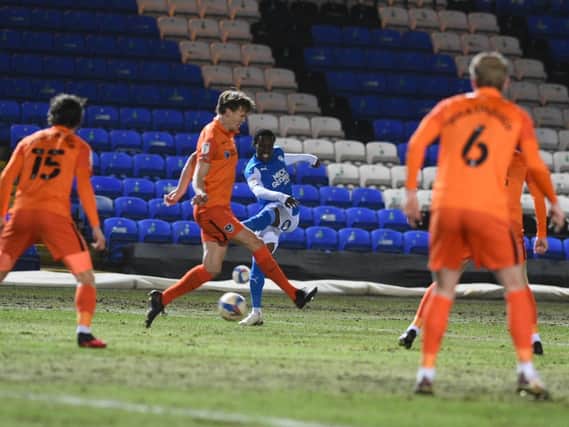 Sirki Dembele gets a shot away during the first half against Portsmouth (Pictures: David Lowndes)