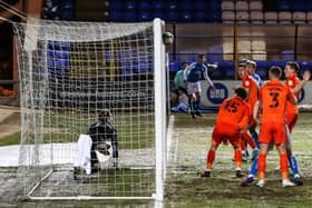 Posh teenager Harrison Burrows watches on as his corner hits the back of the Pompey net. Photo: David Lowndes.