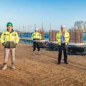 Rhydian Hafal, construction manager, Jones Bros; Lee Baldry, team leader - major projects, Cambridgeshire County Council; Cllr David Connor; and Cllr Steve Count standing on the first earth reinforced abutment.