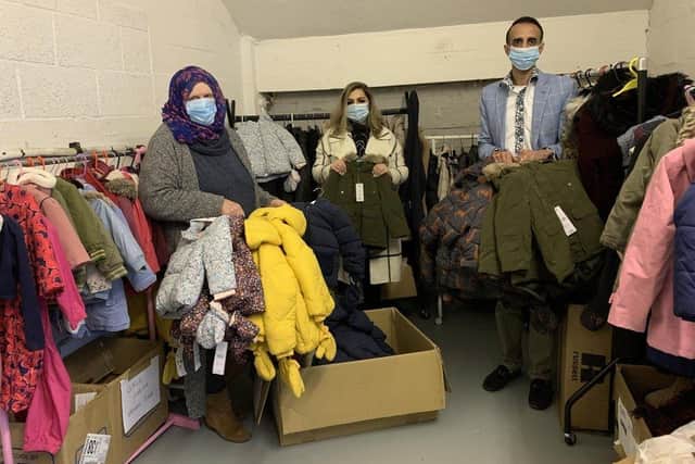Labour councillors Aasiyah Joseph, Ikra Yasin and Shaz Nawaz with coats to be donated to 'Coats for Kids'