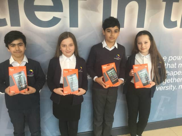 Some of the pupils with their new tablets