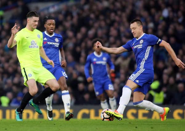 John Terry (right) in action for Chelsea against Posh.