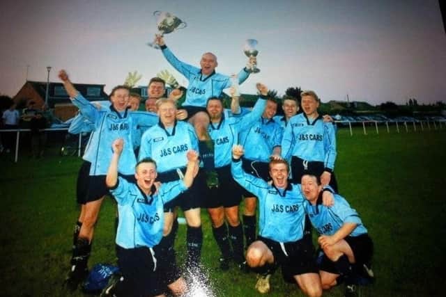 Eye United celebrate their 2000-01 successs. Skipper Alex Brown is holding the trophies.