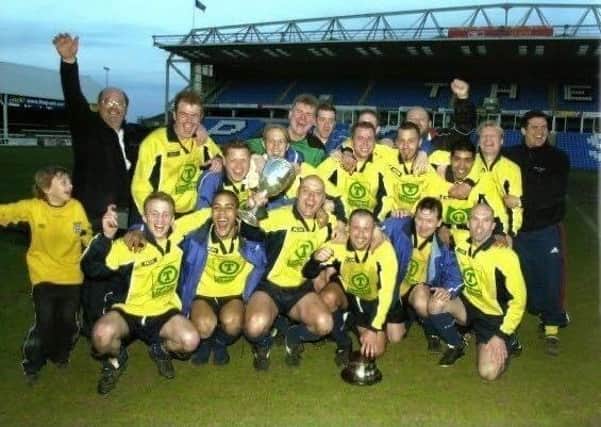 Eye United after their PFA Senior Cup triumph at London Road in May, 2001. Manager Roger Daniels is on the left of the back row.