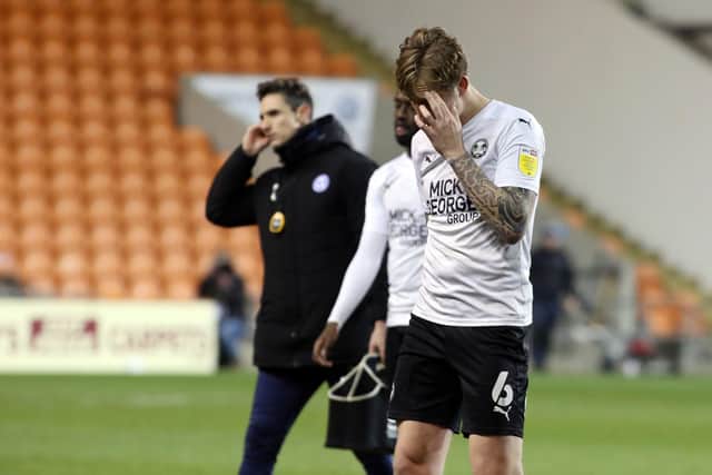 Frankie Kent of Peterborough United leaves the pitch dejected after defeat at Blackpool. Photo: Joe Dent/theposh.com.