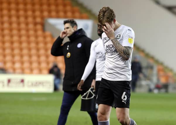 Frankie Kent of Peterborough United leaves the pitch dejected after defeat at Blackpool. Photo: Joe Dent/theposh.com.