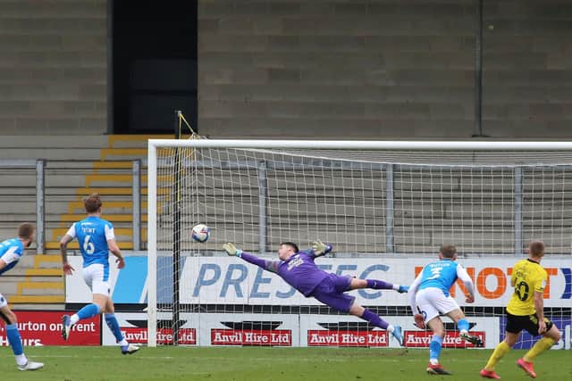 Posh 'keeper Christy Pym makes a great save at Burton in a recent League One match.