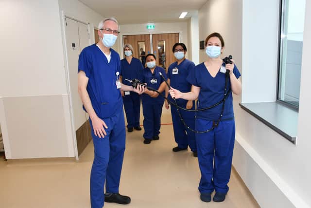 Dr Robert Rintoul and Dr Allanah Barker holding the EUS device, alongside members of the lung cancer team at Royal Papworth Hospital NHS Foundation Trust