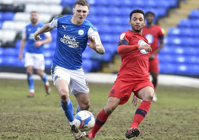 Posh midfielder Jack Taylor in action against Wigan in February.
