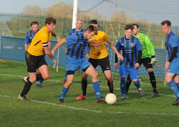 Whittlesey Athletic (blue) in action earlier this season.