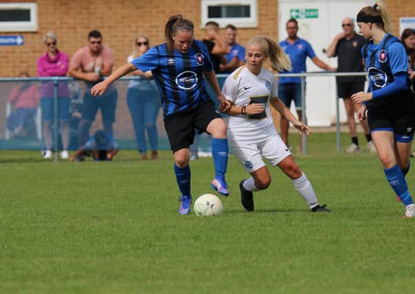 Action from Whitlesey Ladies (blue) v Posh Ladies earlier this season.