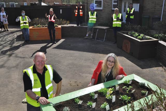 Volunteers from Up The Garden Bath aand residents in Orton Goldhay team up for planting project.