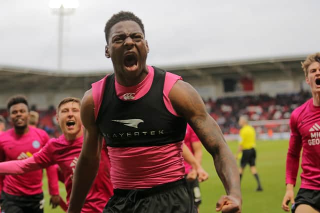 Ricardo Santos celebrates a Posh goal at Doncaster.