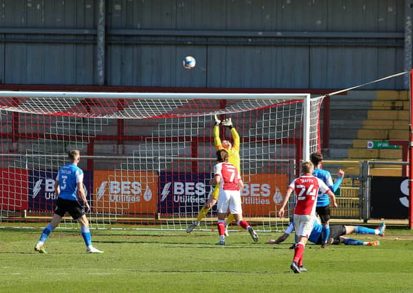 Christy Pym of Peterborough United watches as Wes Burns (7) of Fleetwood Town fires over the bar from close range on the stroke of-half-time. Photo: Joe Dent/theposh.com.