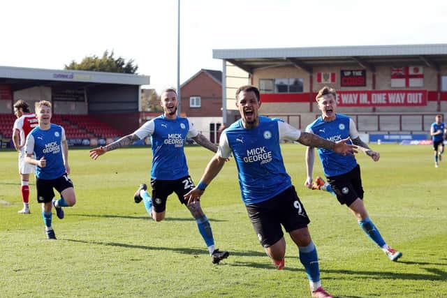 Jonson Clarke-Harris celebrates his late winning goal (Photo: Joe Dent).