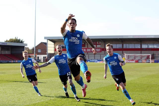 Jonson Clarke-Harris of Peterborough United celebrates scoring the winning goal against Fleetwood Town. Photo: Joe Dent/theposh.com.