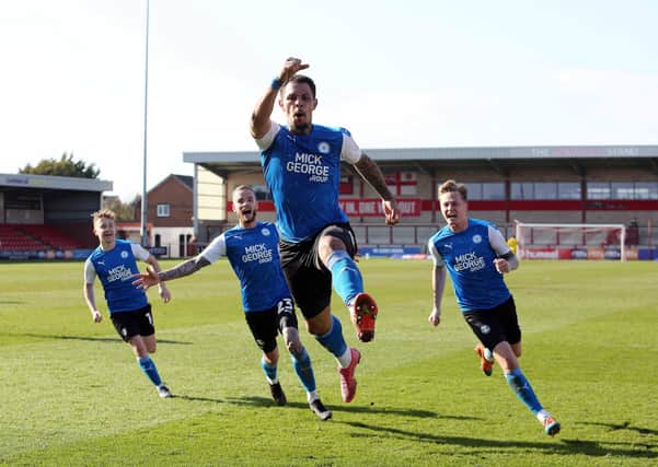 Jonson Clarke-Harris of Peterborough United celebrates scoring the winning goal against Fleetwood Town. Photo: Joe Dent/theposh.com.