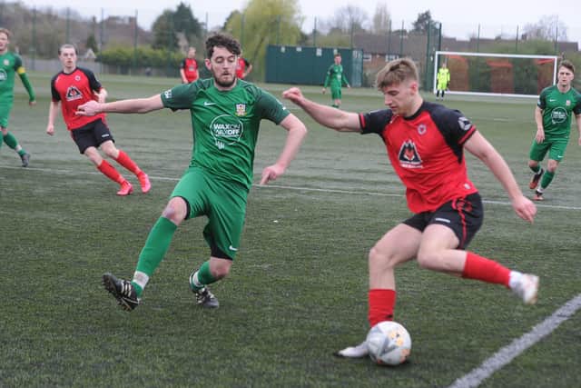 Robbie Ellis (red) in action for Netherton against Cottesmore last weekend. Photo: David Lowndes.