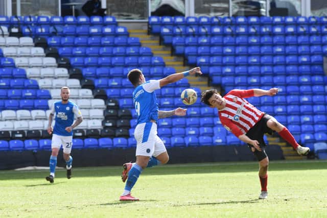 Sunderland defender Luke O'Nein makes an unsual clearance in the 1-1 draw with Posh. Photo: David Lowndes.