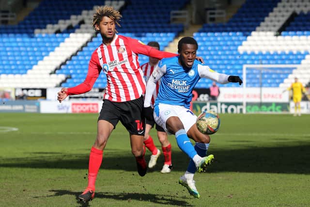 Siriki Dembele of Peterborough United in action with Dion Sanderson of Sunderland. Photo: Joe Dent/theposh.com.
