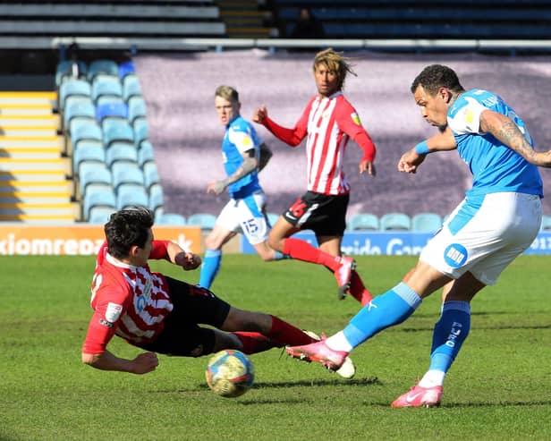 Jonson Clarke-Harris of Peterborough United has a shot blocked by Luke O'Nien of Sunderland. Photo: Joe Dent/theposh.com.
