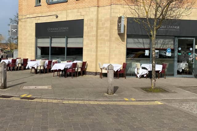 Tables and chairs outside Gurkha Lounge