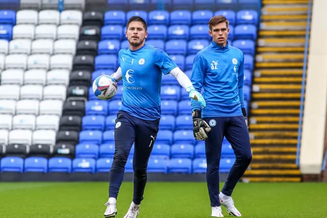 Will Blackmore (right) warms up with first-team goalkeeper Christy Pym.