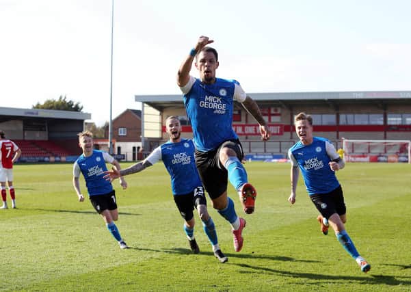 Jonson Clarke-Harris of Peterborough United celebrates a winning goal at Fleetwood on Good Friday.