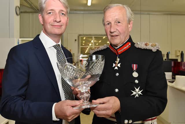Photocentric MD Paul Holt, left, receives the Queen's Award for Innovation from Sir Hugh Duberly, the Lord Lt of Cambridgeshire in 2016.
