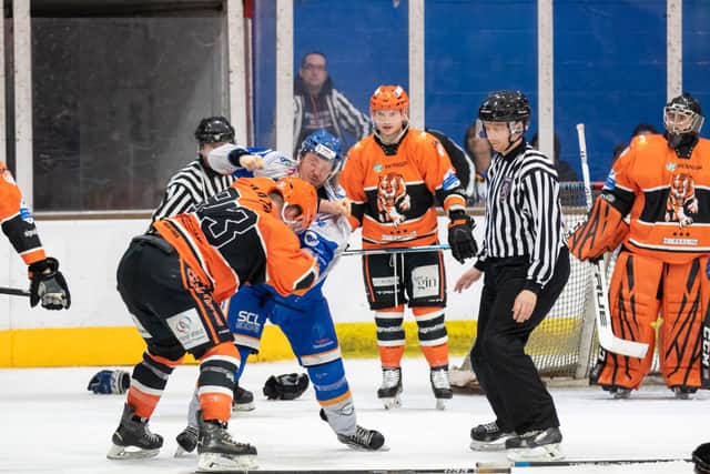 Phantoms' Will Weldon (white) and Telford's Jack Watkins had a disagreement in the closing stages of the cup final first leg. Photo: Tom Scott.