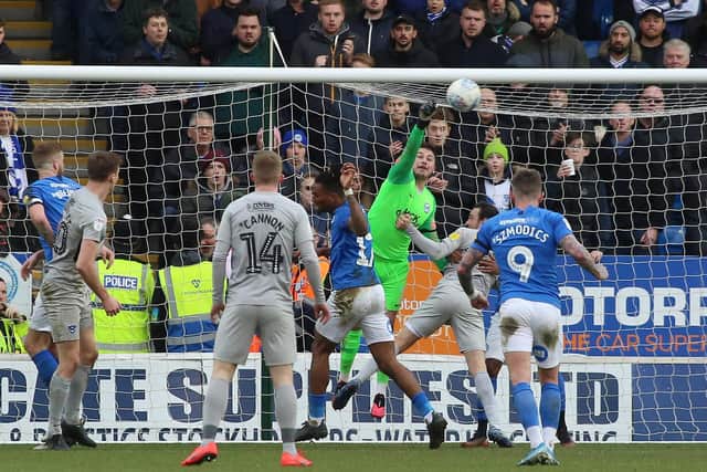 Goalkeeper Christy Pym of Peterborough United punches the ball away from danger in the game against Portsmouth. Photo: Joe Dent/theposh.com.