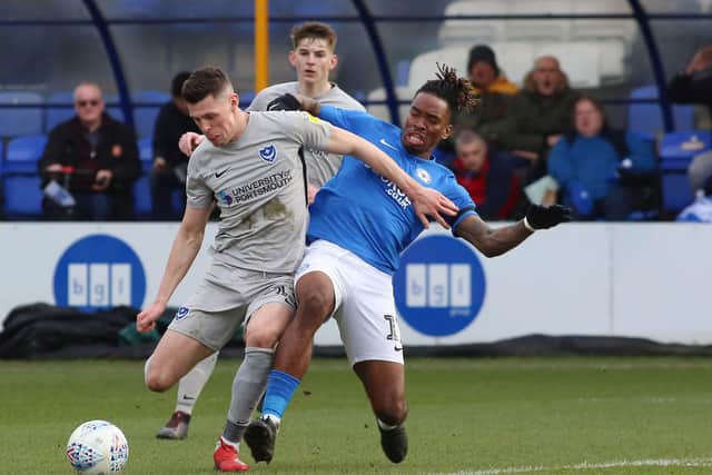 Ivan Toney of Peterborough United tackles James Bolton of Portsmouth. Photo: Joe Dent/theposh.com.